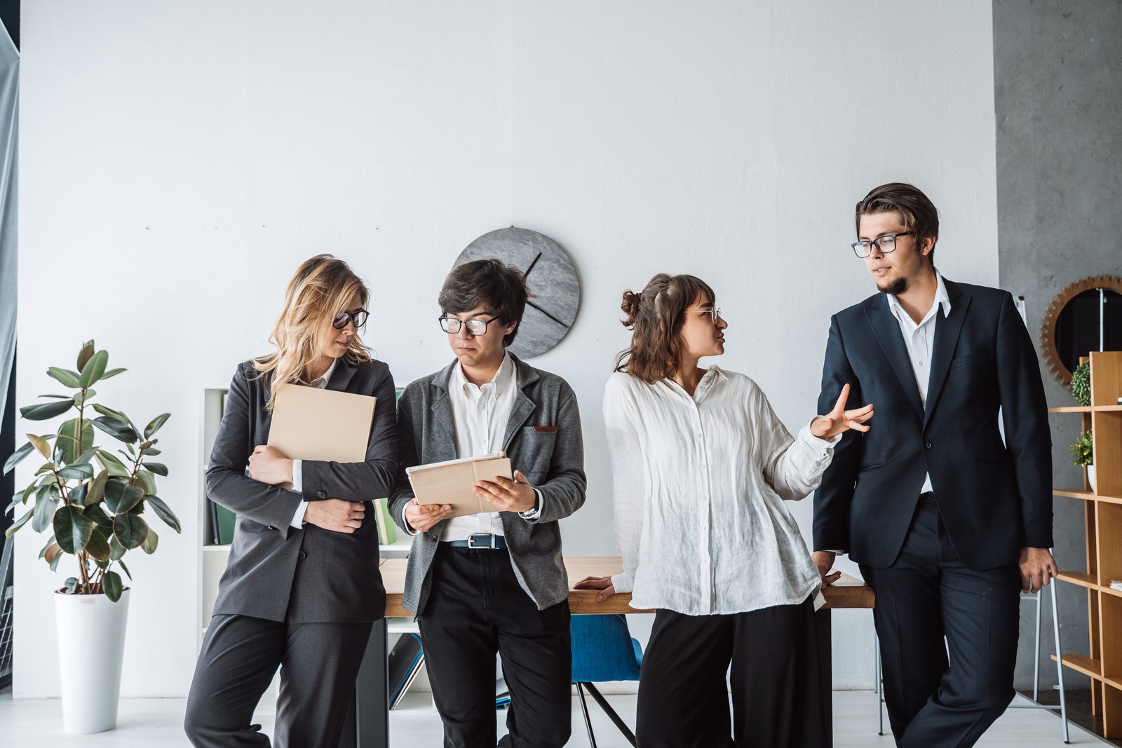 Office workers discussing the rollout of Microsoft Copilot AI agents and the budget for Copilot Credits
